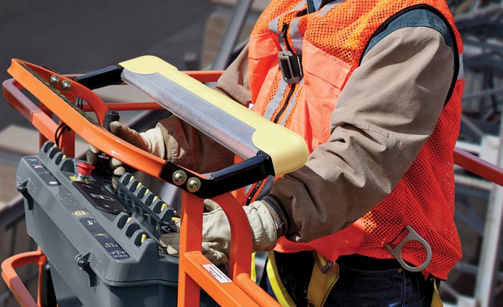image of person standing on a boom lift